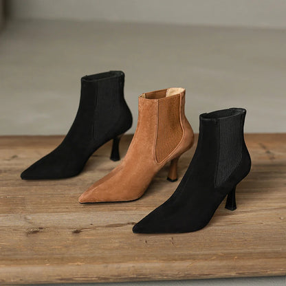 Collection of brown and black suede pointed toe ankle boots