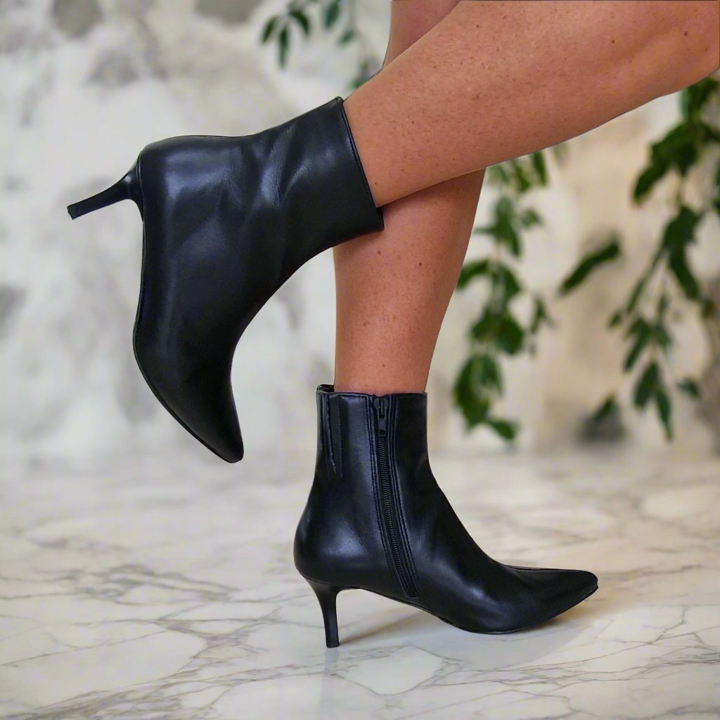 Black leather pointed toe ankle boots