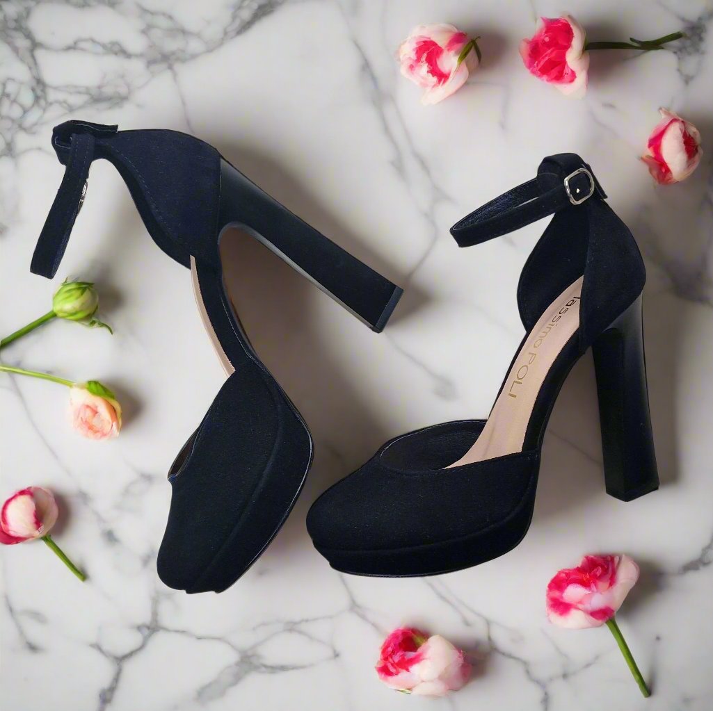 Black suede stiletto sandals set on a platform