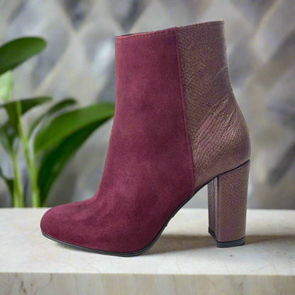 Burgundy suede ankle boots set on a block heel