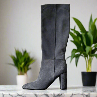 Knee high boots set on a high heel in grey suede leather