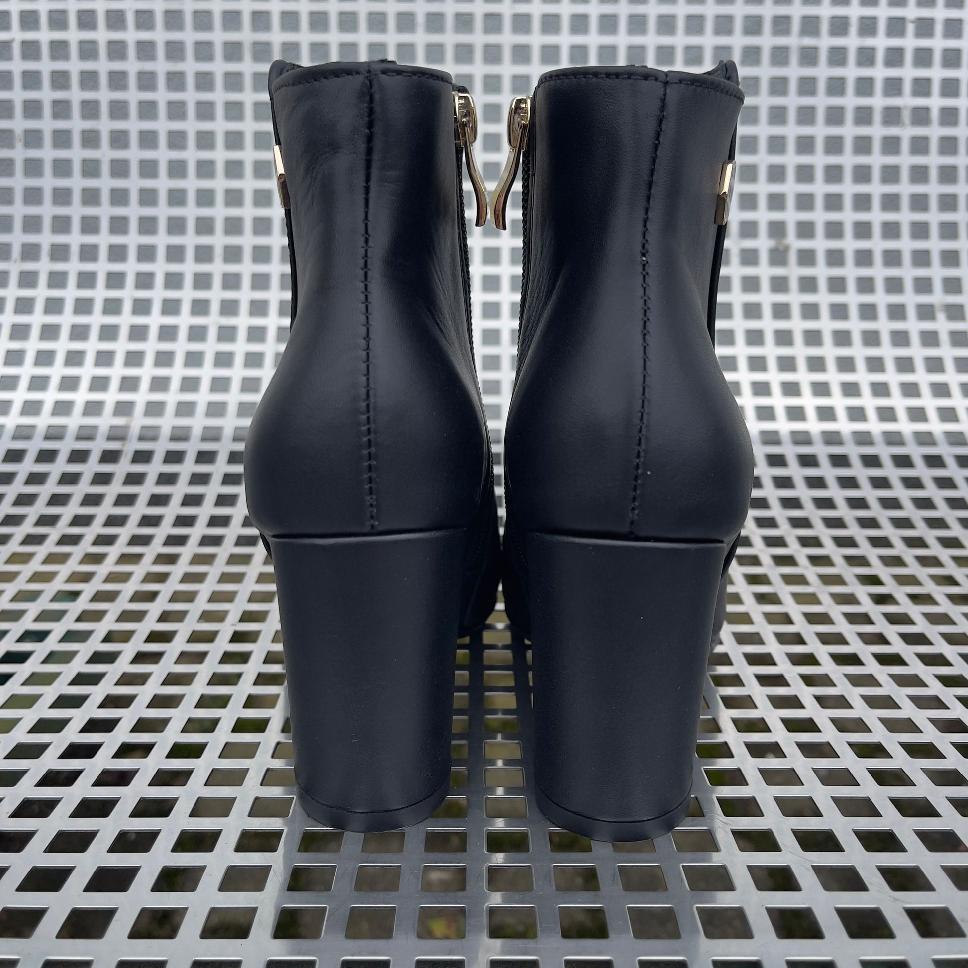 Petite size black leather ankle boots