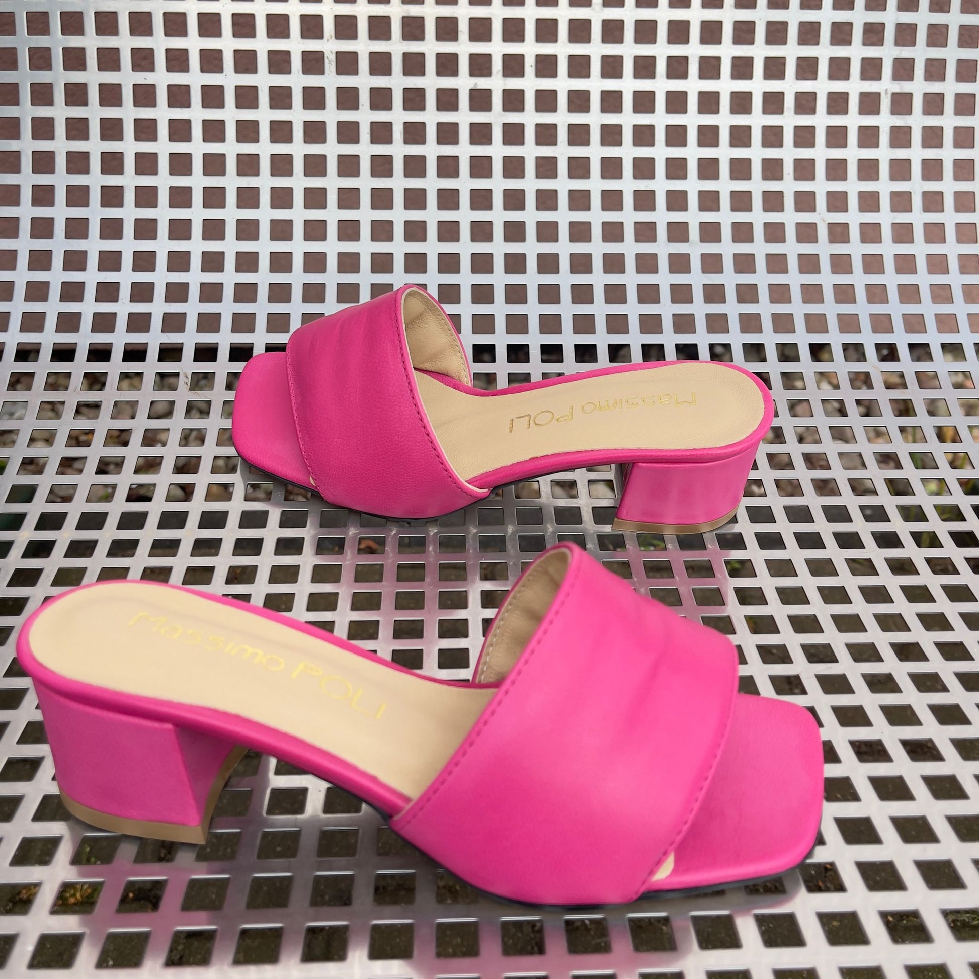 Hot pink leather ladies slider shoes set on a kitten heel