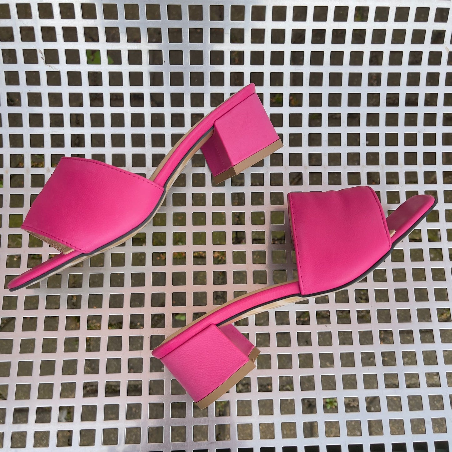 Hot pink leather ladies slider shoes set on a kitten heel