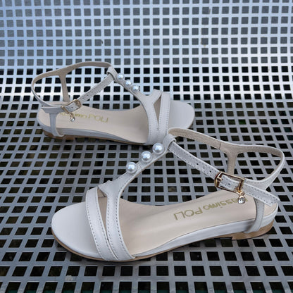 Small size ladies flat sandals in nude colour adorned with white pearls