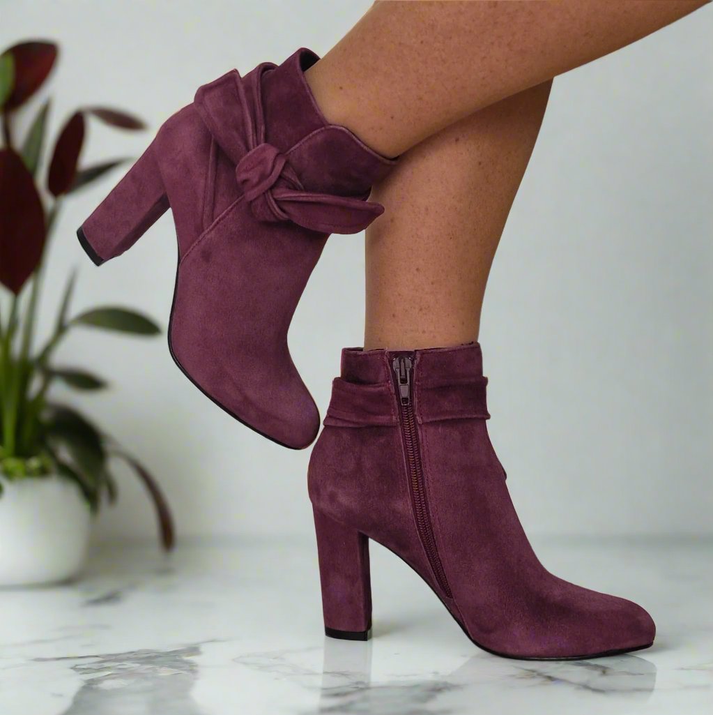 Woman wearing  petitered leather ankle boots