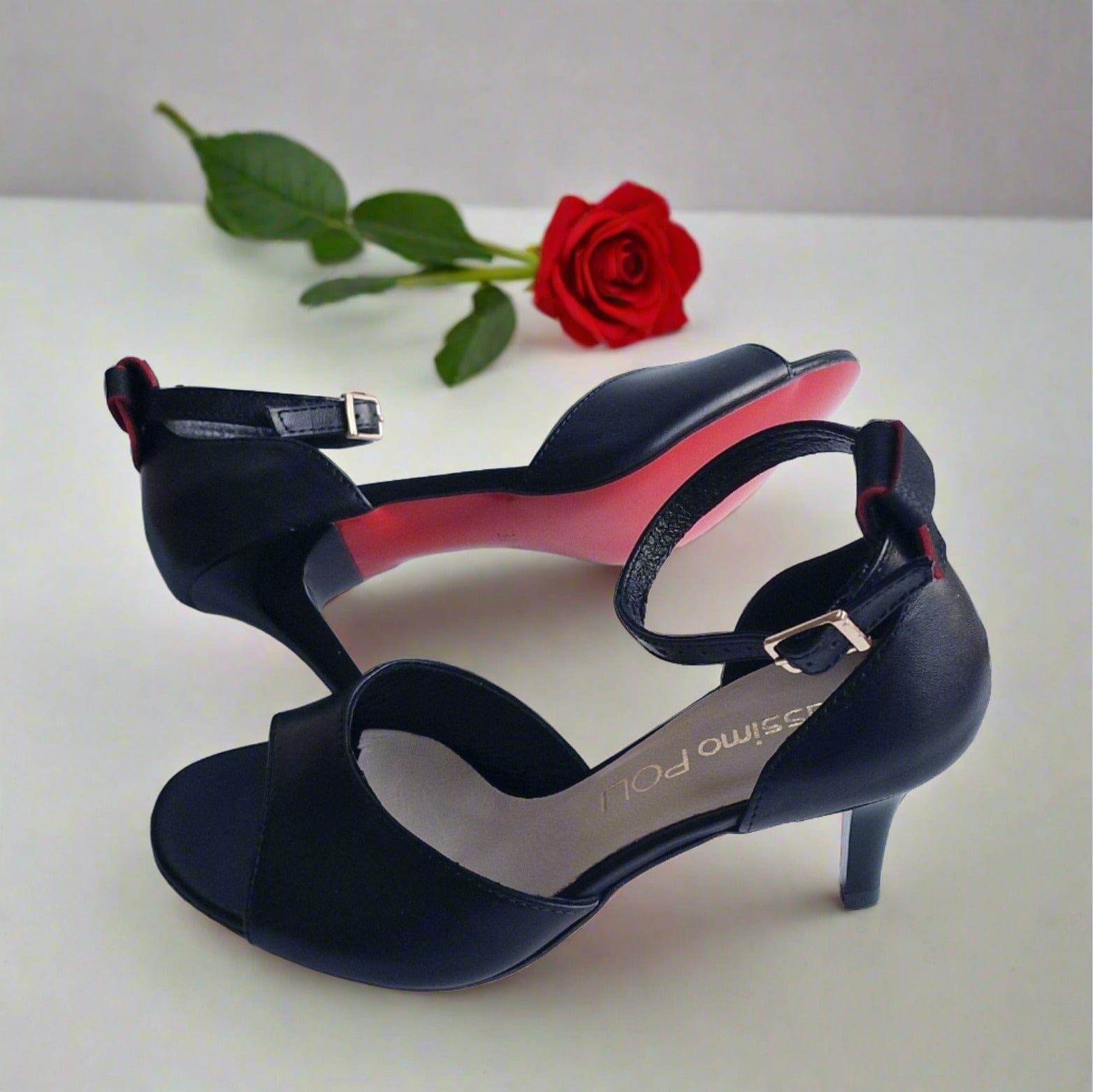 Red sole kitten heels in black leather