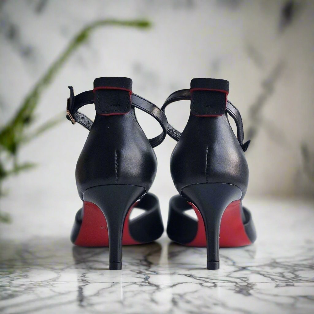 Red sole kitten heels in black leather