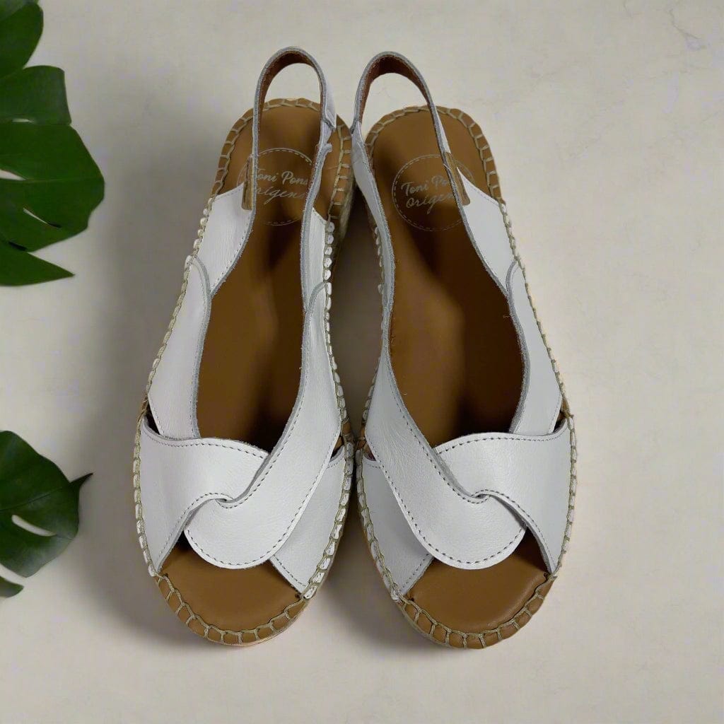 White leather handmade espadrilles set on a platform