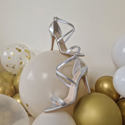 Cross strap high heel sandals in silver leather