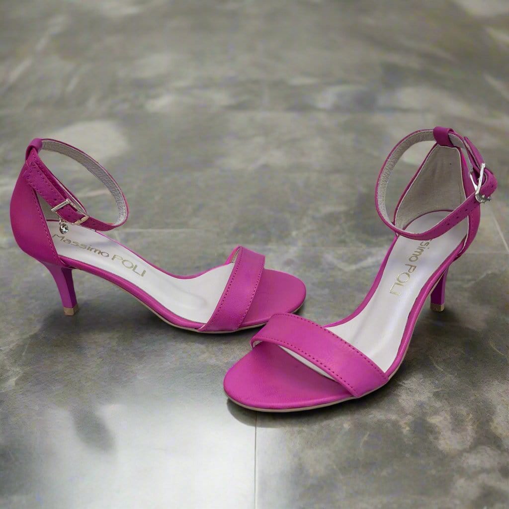 Hot pink leather ankle strap sandals set on a kitten heel