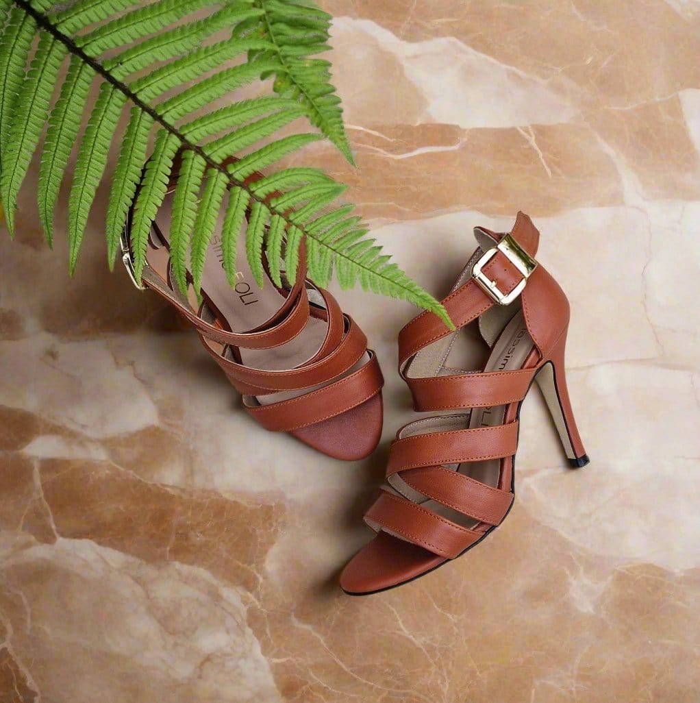 gold buckle strappy sandals in tan leather with a high heel