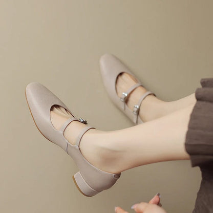 Petite beige leather Mary Jane style shoes on a kitten heel