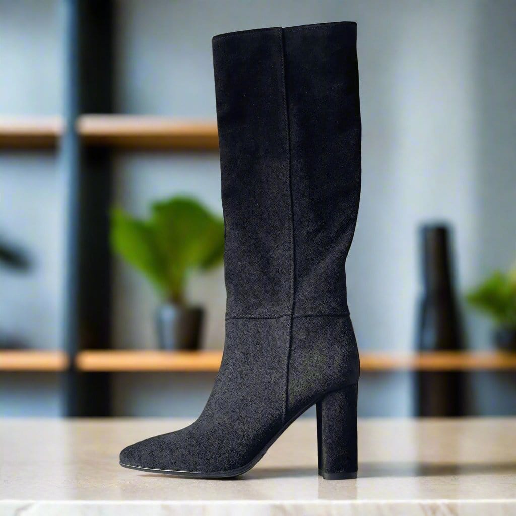 Petite knee high boots in black suede set on a high heel