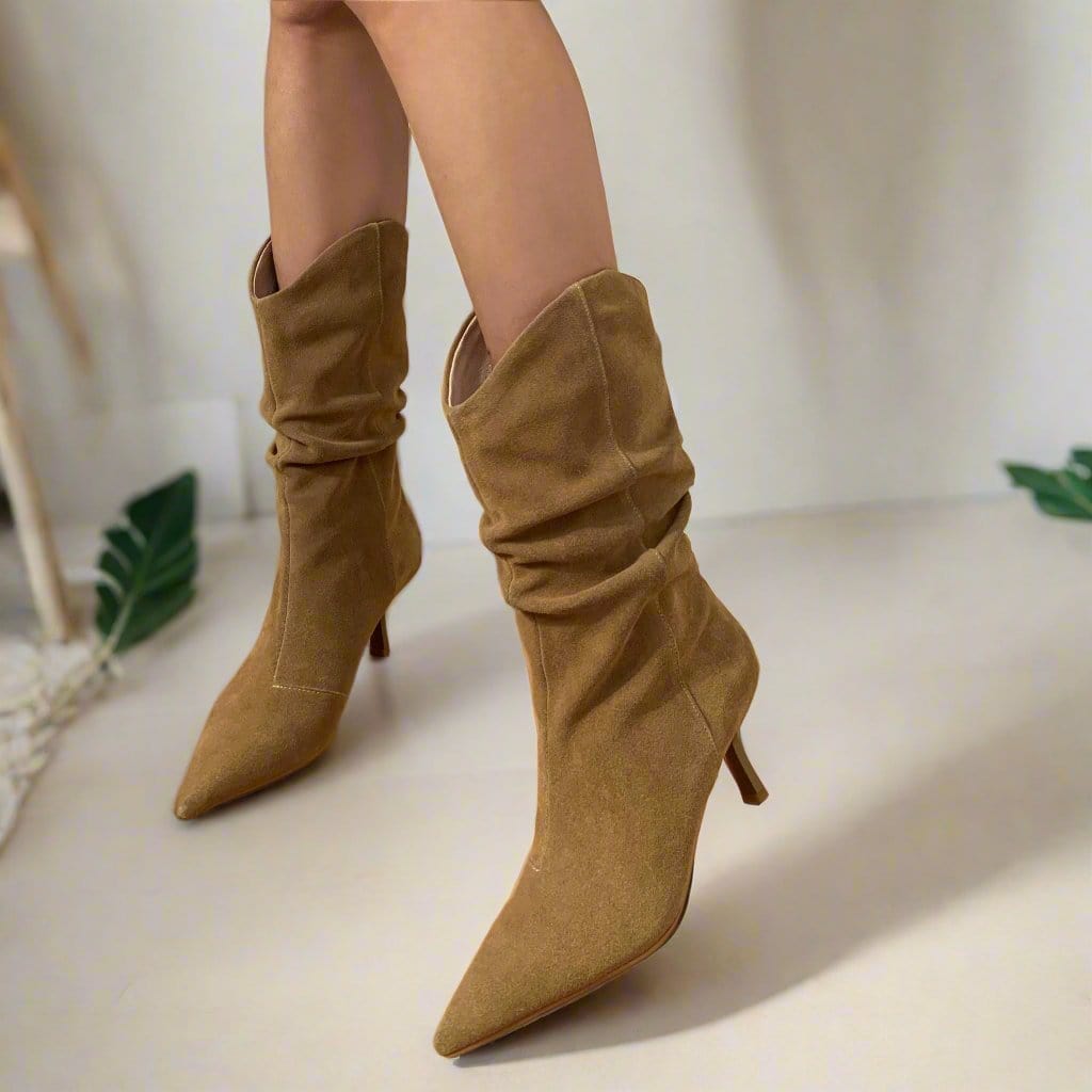 Woman wearing beige suede slouchy boots