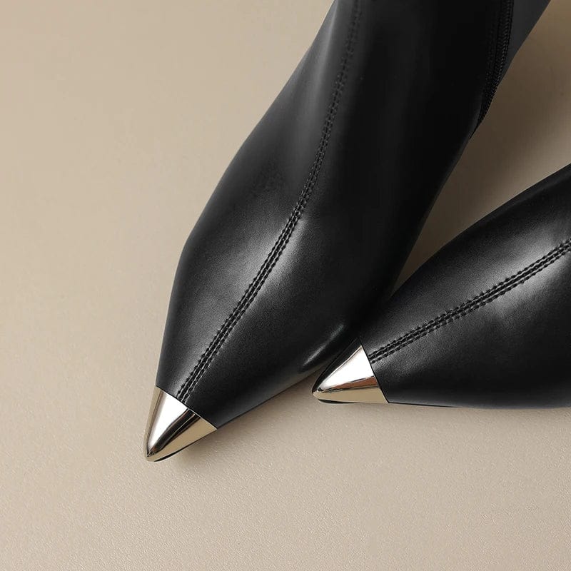 Black leather pointed toe boots