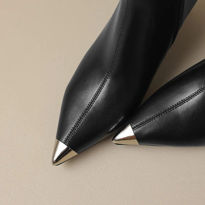 Black leather pointed toe boots