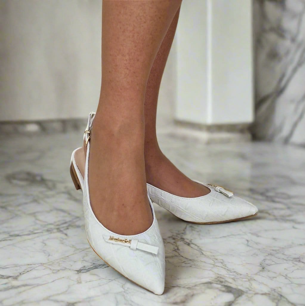 Woman wearing petite white slingbacks