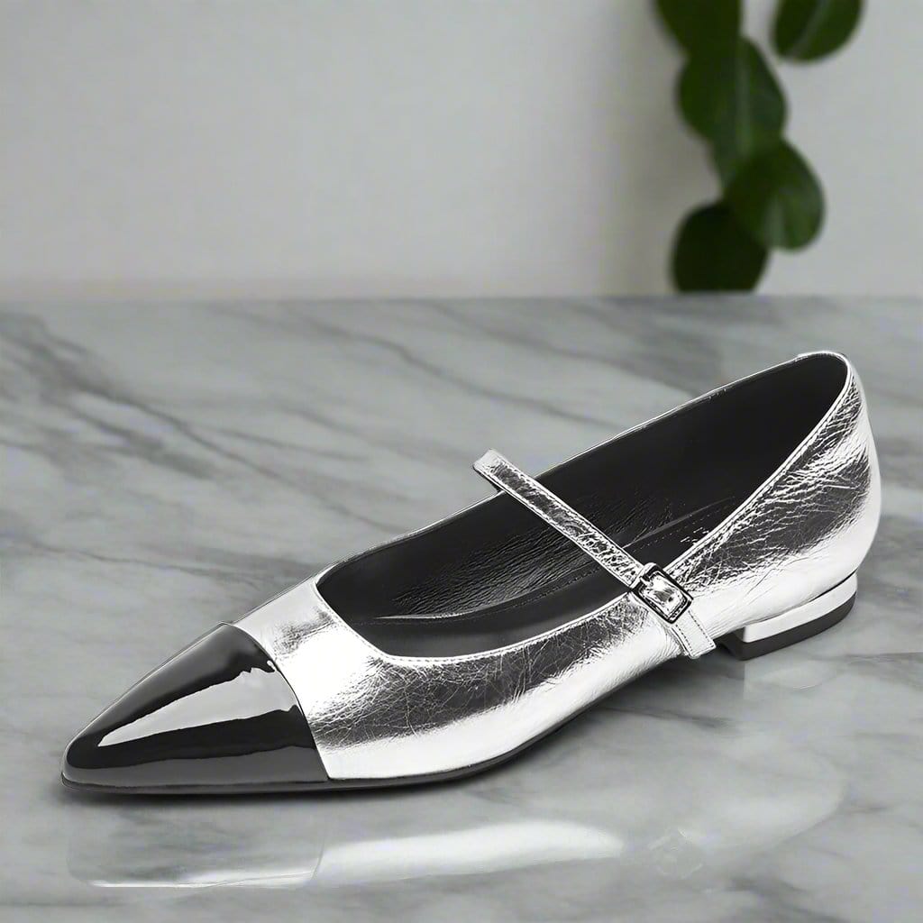 Silver leather Mary Jane style shoes with black toe cap