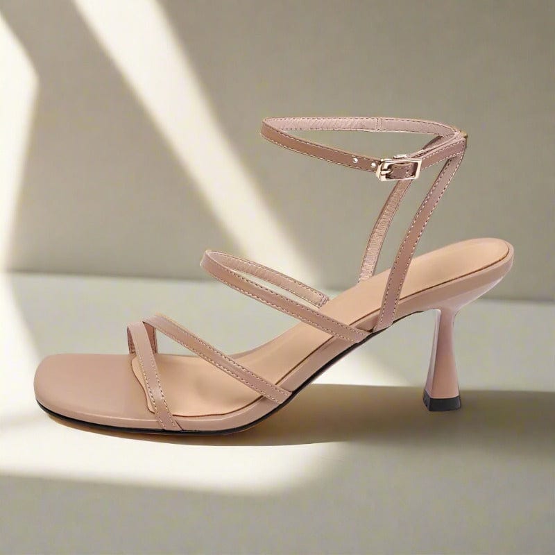 Beige leather ankle strap sandals set on a 7cm heel