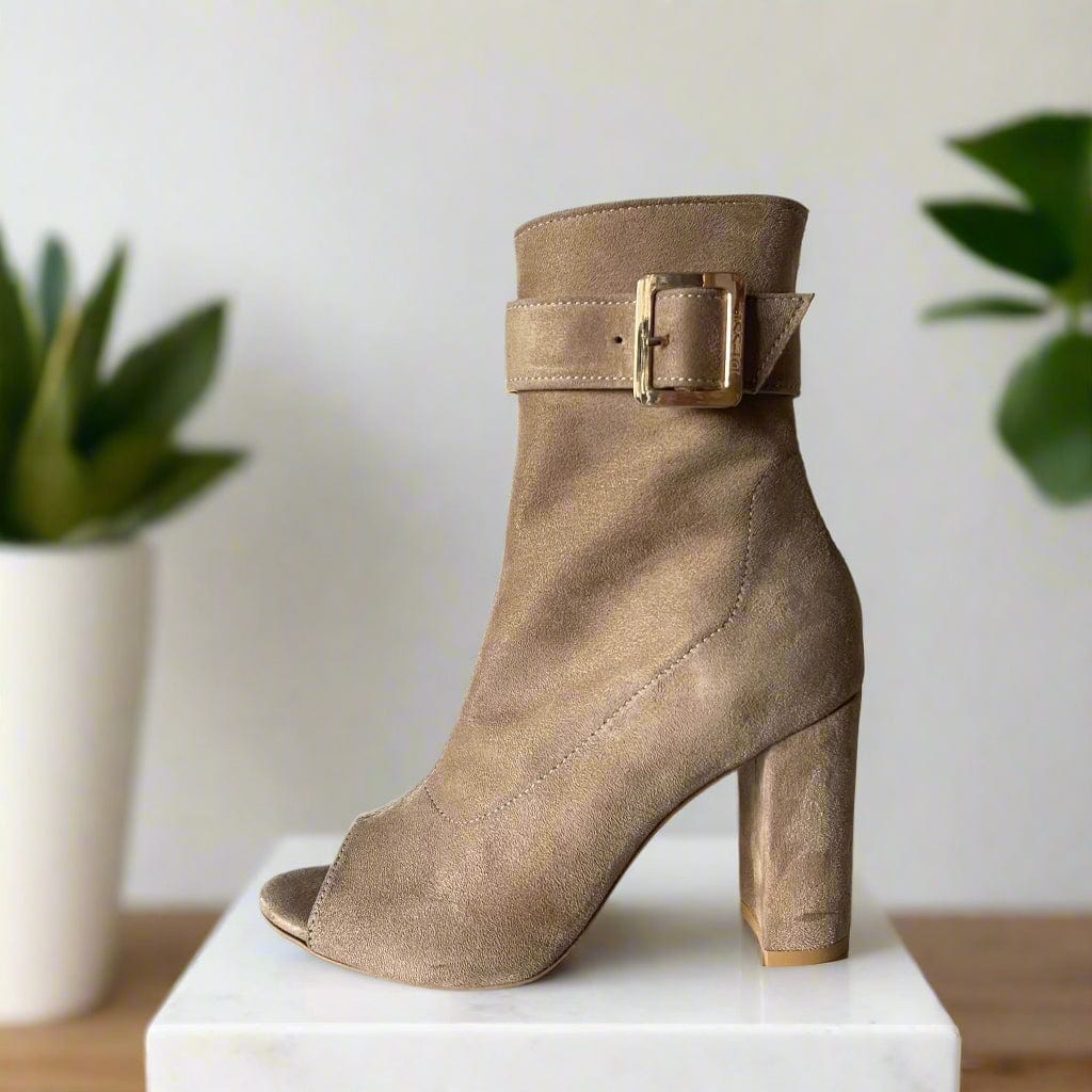 Beige peep toe boots set on a block heel