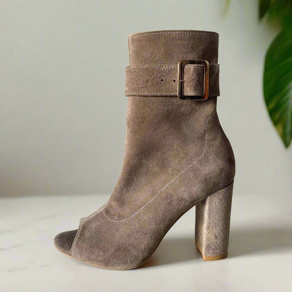 Beige suede open toe calf boots with a gold buckle