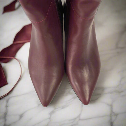 Red leather pointed toe boots